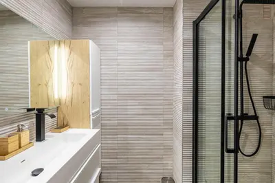 a bathroom with a shower and a sink at Cozy renovated apartment - close to Martinez Hotel in Cannes