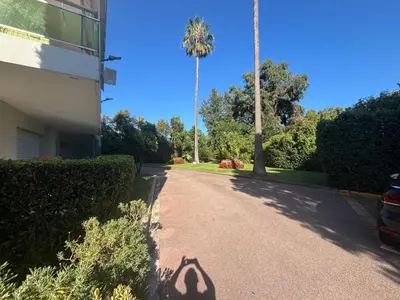 a shadow of a peace sign on a driveway at Mathéo in Cannes
