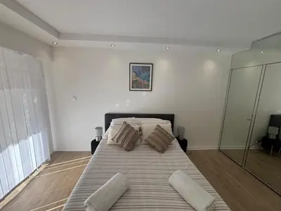 a bedroom with a large bed with pillows on it at Mathéo in Cannes
