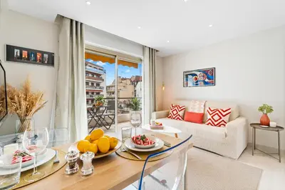 a living room with a table with fruit on it at Downtown Cannes Modern 1-Br Apartment in Cannes
