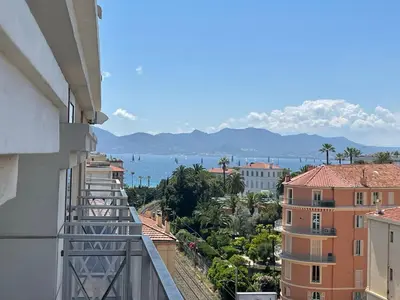 a view of the ocean from a balcony of a building at Studio Balcon Centre Plage in Cannes