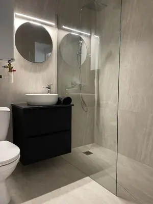 a bathroom with a sink and a toilet and a shower at Studio Balcon Centre Plage in Cannes