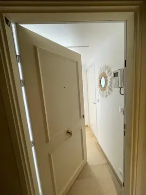 an open door in a room with a hallway at Studio Balcon Centre Plage in Cannes