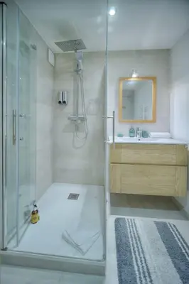 a bathroom with a shower and a sink at IMMOGROOM - Heart of the Suquet - City center - Modern in Cannes