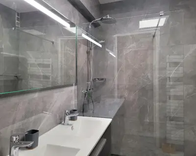 a bathroom with a sink and a glass shower at LA PRESQU'ILE T2 PALM BEACH MOURE ROUGE in Cannes