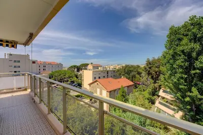 a balcony with a view of a city at Cannes Californie Beautiful Apt with Sea View in Cannes