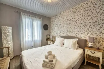 a bedroom with a bed with towels on it at NEW 2-bed Central Cannes Apt in Cannes