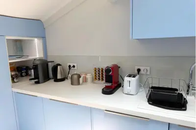 a kitchen counter with various appliances on it at 06DI Cannes Hoche in Cannes