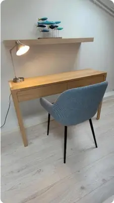 a wooden desk with a blue chair and a lamp at 06DI Cannes Hoche in Cannes