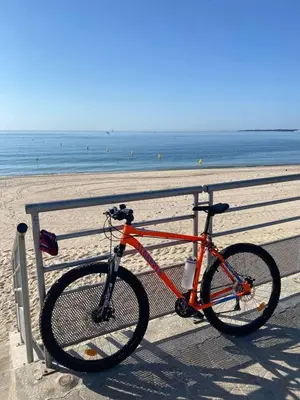 a bike parked next to a fence at the beach at Villa Riviera in Le Cannet