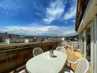 a table and chairs on a balcony with a view at Colony apartment with parking, by Welcome to Cannes in Cannes