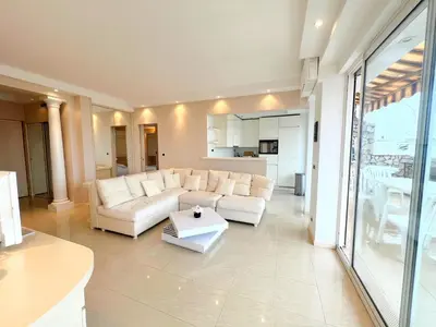 a living room with a white couch and a table at Colony apartment with parking, by Welcome to Cannes in Cannes