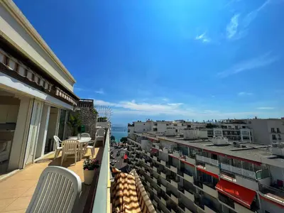 a balcony with chairs and a view of a city at Colony apartment with parking, by Welcome to Cannes in Cannes