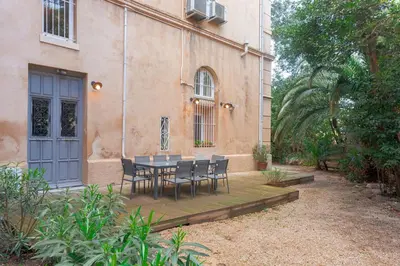 a living room with a couch and a fireplace at Duplex Saint-henry by Halldis in Cannes