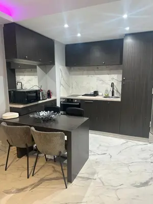a kitchen with a table and chairs in a room at Apartment best position croisette martinez ! 150m from the beach completely renovated ! in Cannes