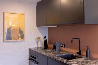 a kitchen with a sink and a counter top at Duplex Pradignac by Halldis in Cannes