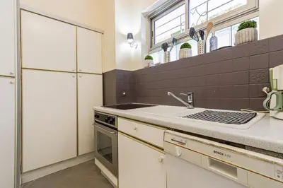 a kitchen with a sink and a stove at Cannes centre - Vue Mer, Piscine, Terrasse in Cannes