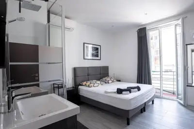 a bedroom with a bed and a bath tub at cannes experience pastour DUPLEX Penthouse Rooftop 4 bed&4bath Sea&Suquet view walking distance palais des congres & beaches in Cannes
