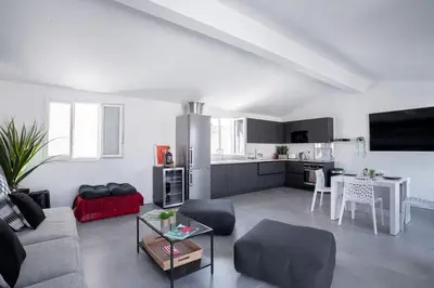 a living room with a couch and a table at cannes experience pastour DUPLEX Penthouse Rooftop 4 bed&4bath Sea&Suquet view walking distance palais des congres & beaches in Cannes
