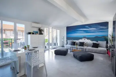 a living room with a couch and a table at cannes experience pastour DUPLEX Penthouse Rooftop 4 bed&4bath Sea&Suquet view walking distance palais des congres & beaches in Cannes