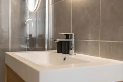 a bathroom sink with a faucet on top of it at Splendide et idéalement situé proche du palais. in Cannes