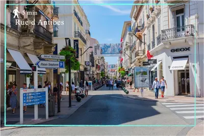 a city street with people walking down the street at Suite Jam - Superbe Appartement à Cannes in Cannes