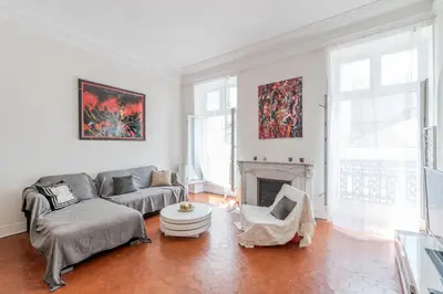 a living room with a couch and a fireplace at BARBARA by Terry's Homes in Cannes