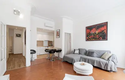 a living room with a couch and a table at BARBARA by Terry's Homes in Cannes