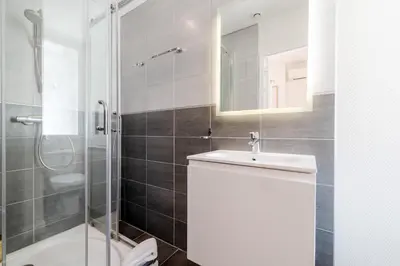 a bathroom with a sink and a shower and a toilet at BARBARA by Terry's Homes in Cannes