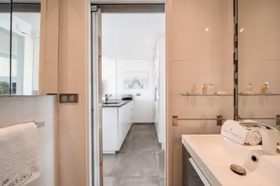 a small bathroom with a sink and a counter at Studio mer Croisette in Cannes