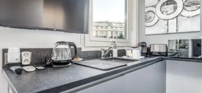 a kitchen counter top with a coffee maker on it at Studio mer Croisette in Cannes