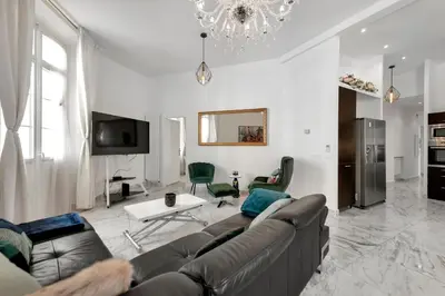 a living room with a couch and a table at Le Borniol, splendid 3 bedrooms Appt, Cannes Center in Cannes