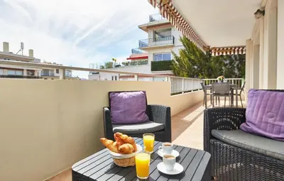 a balcony with a table and chairs and a view at Cannes centre-Palais-200m des plages in Cannes