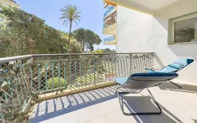 a pair of chairs on the balcony of a house at Le Marilyn by Winsome Destination in Cannes