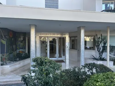 a building with columns and plants in front of it at Le Marilyn by Winsome Destination in Cannes