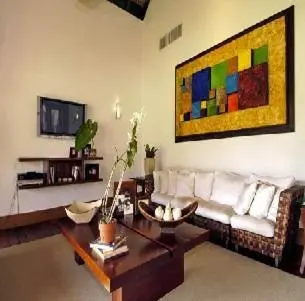 a living room with a couch and a table at Darbin ~ in Cannes
