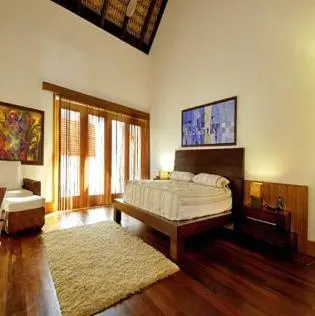 a large bedroom with a bed and a rug at Darbin ~ in Cannes
