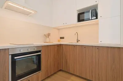 a kitchen with a sink and a stove at L'impérator by Winsome Destination in Cannes