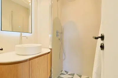 a bathroom with a sink and a shower at L'impérator by Winsome Destination in Cannes