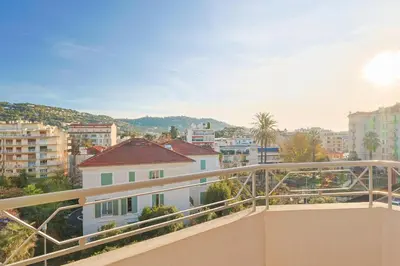 a balcony with a view of a city at L'impérator by Winsome Destination in Cannes