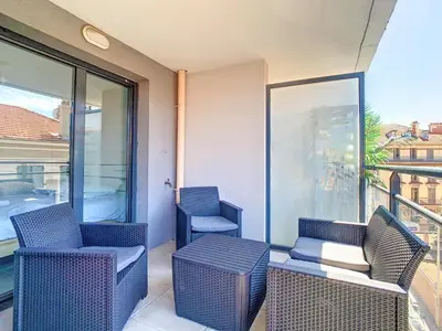 a balcony with two chairs and a table on a balcony at 2p Cannes centre-ville Terrasse in Cannes