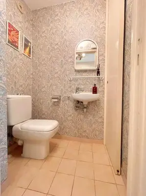a bathroom with a toilet and a sink at Appartement cannes Croisette in Cannes