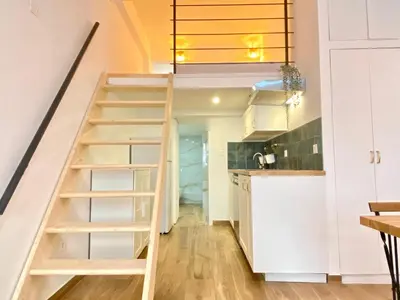 a staircase leading up to the kitchen in a tiny house at Le Perrissol By SCLS Locations in Cannes