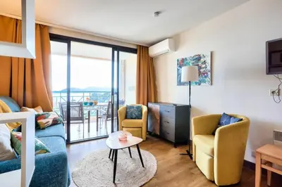 a living room with a couch and two chairs and a table at Résidence Cannes Villa Francia - maeva Home - Appartement vue mer 3 pièces 6 personnes - Prestige MAE-9674 in Cannes