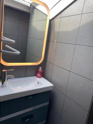 a bathroom with a sink and a mirror at WE CANNES ! Cocoon Duplex in dowtown in Cannes