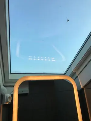 a window on a train with a blue at WE CANNES ! Cocoon Duplex in dowtown in Cannes