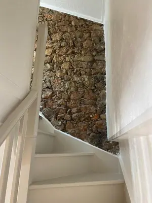 a stairway with a stone wall next to a building at WE CANNES ! Cocoon Duplex in dowtown in Cannes