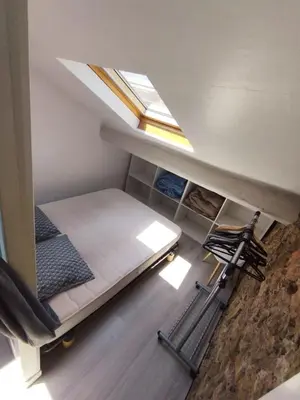 an attic room with a bunk bed and a skylight at WE CANNES ! Cocoon Duplex in dowtown in Cannes