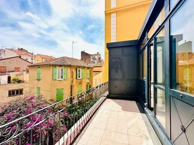 a balcony with a view of a city at L'Imperial - Magnifique Appartement Cannes 5 chambres in Cannes