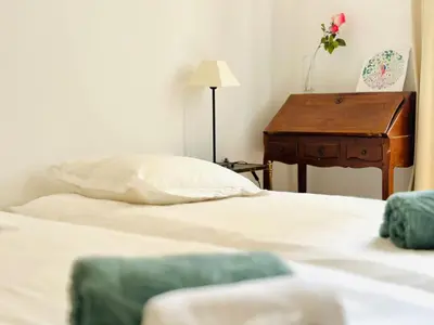 a pile of towels and products on a bed at L'Imperial - Magnifique Appartement Cannes 5 chambres in Cannes